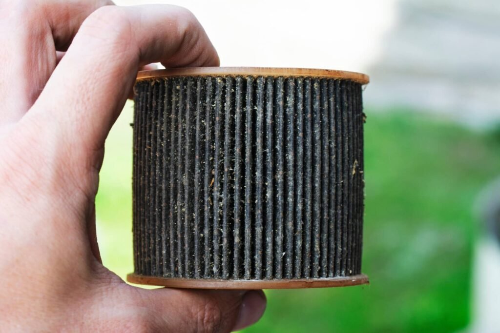 Close-up of a dirty oil filter