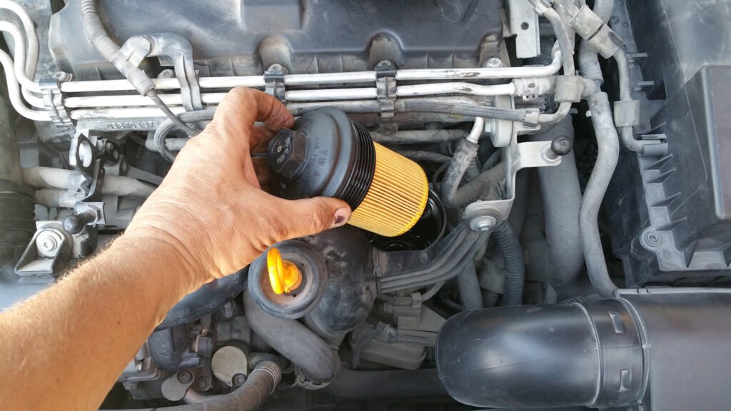 Hand installing car oil filter