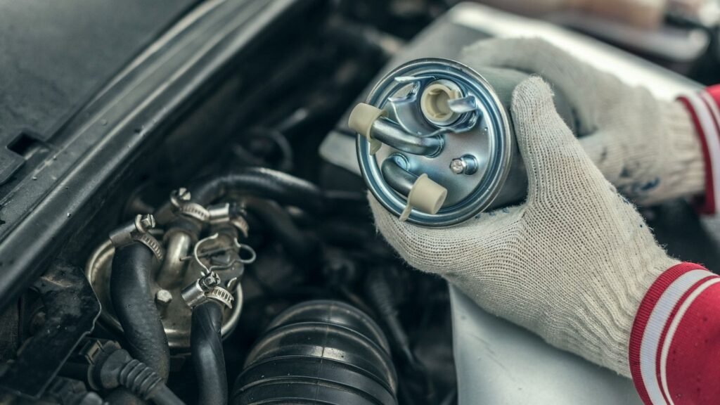 Mechanic holding a fuel filter