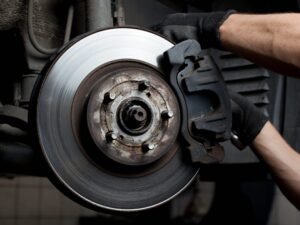 Mechanic replacing brake components