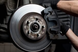 Mechanic replacing brake components